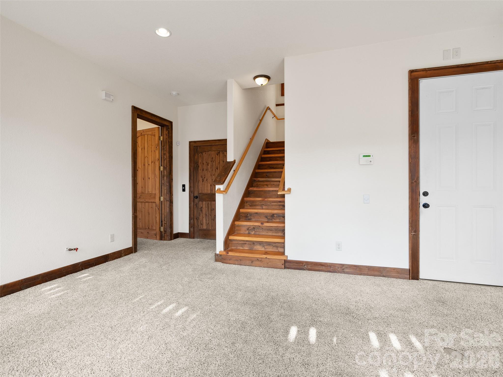 173 Heavenview Point Maggie Valley, NC 28751 - Photo 9 of 47 a view of an empty room with stairs