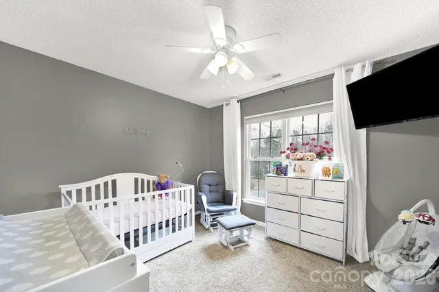a bedroom with furniture and a window