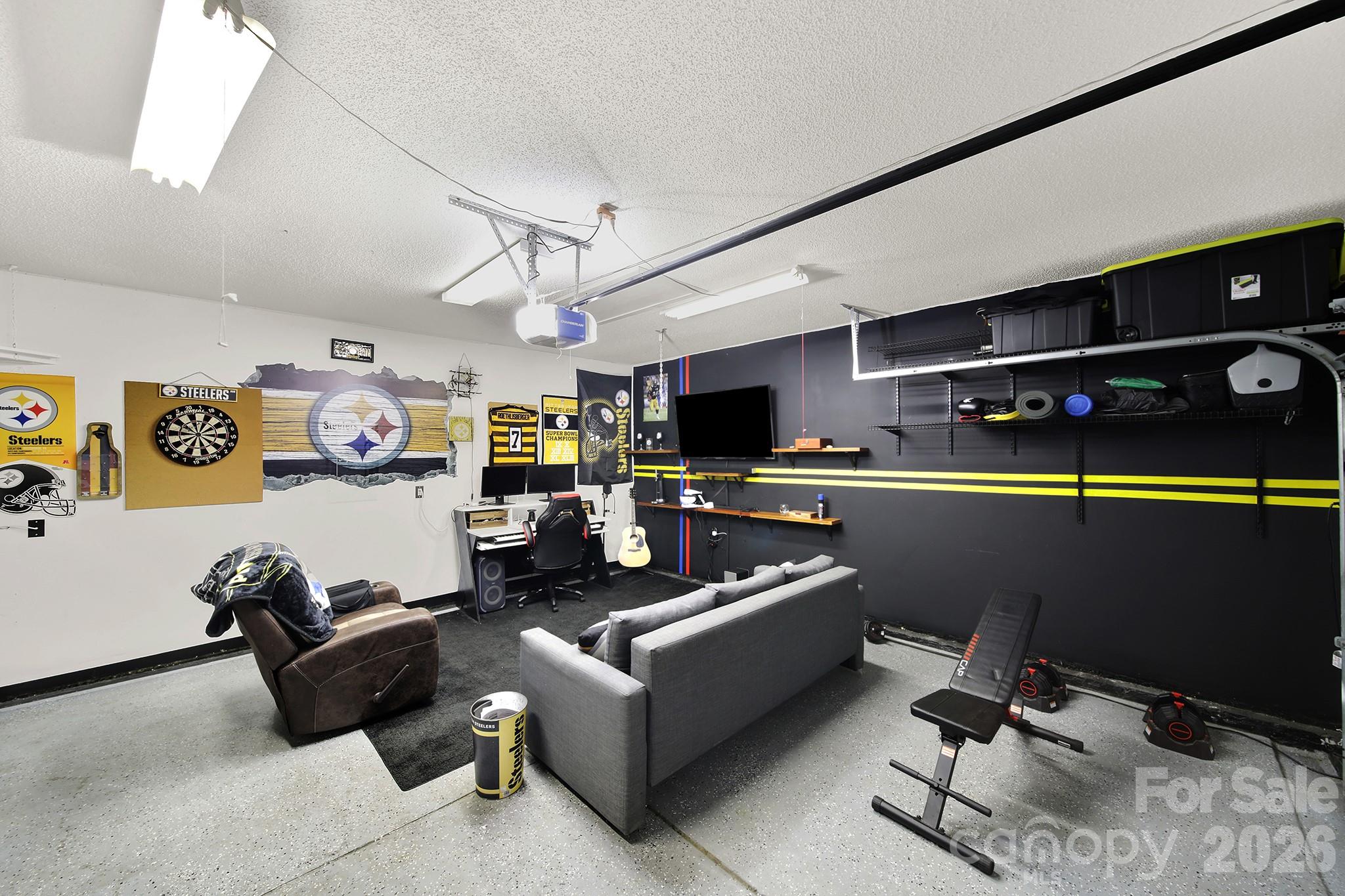 308 Patrick Avenue Southwest Concord, NC 28025 - Photo 19 of 26 a living room with furniture and a flat screen tv