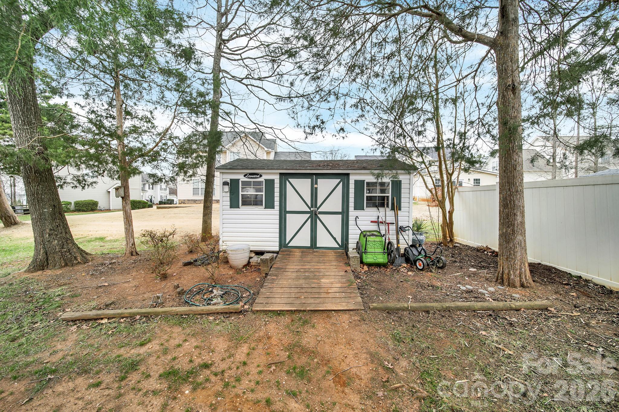 308 Patrick Avenue Southwest Concord, NC 28025 - Photo 24 of 26 a view of a house with a yard covered in snow