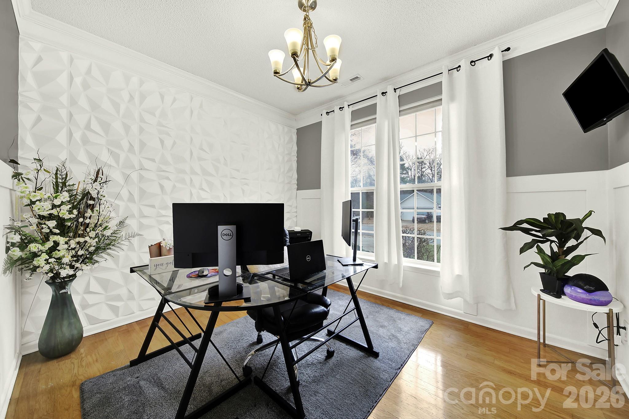 308 Patrick Avenue Southwest Concord, NC 28025 - Photo 3 of 26 a view of a livingroom with furniture and a potted plant