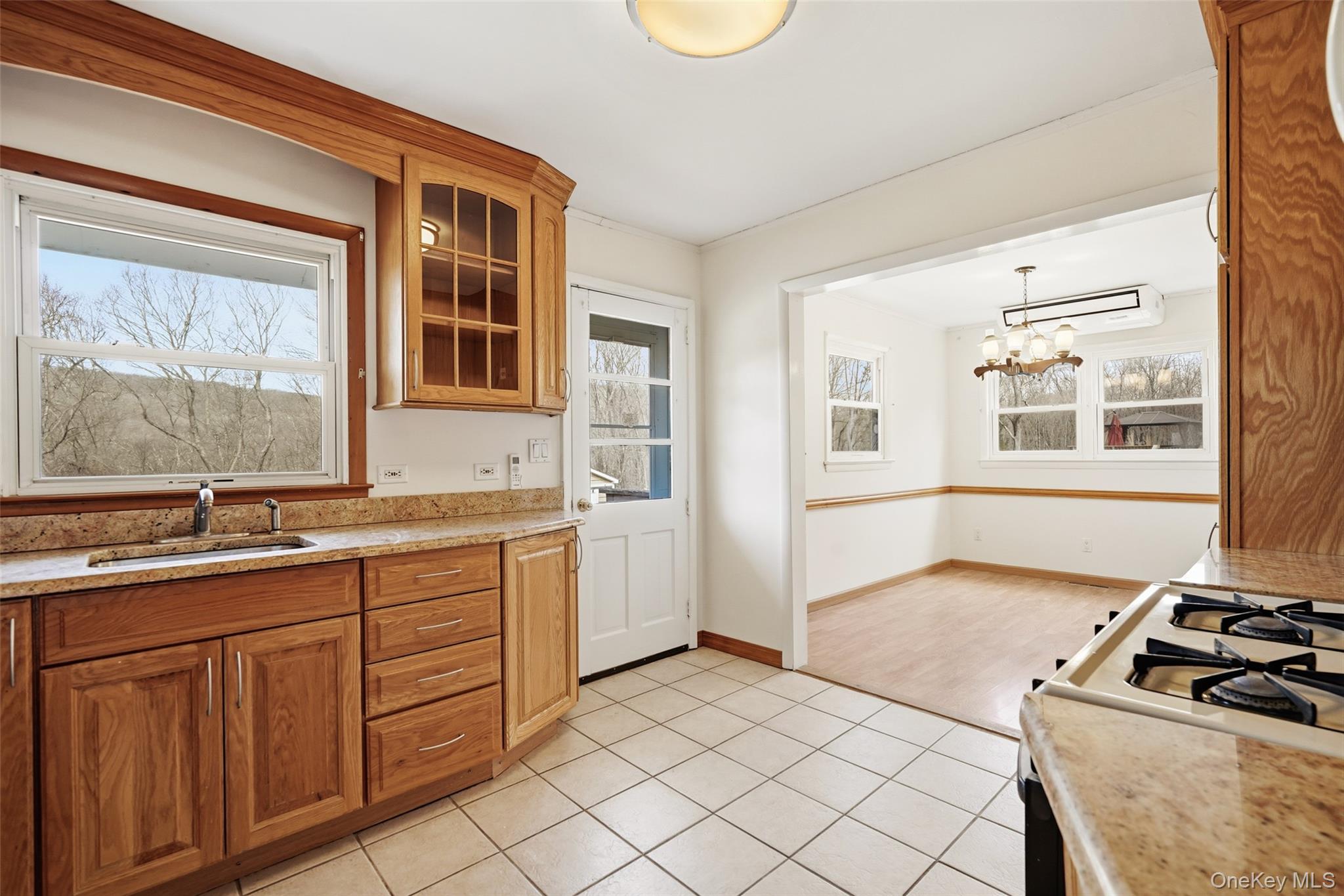 59 Brook Street Mahopac, NY 10541 - Photo 11 of 37 Sunfilled kitchen leading to dining area.