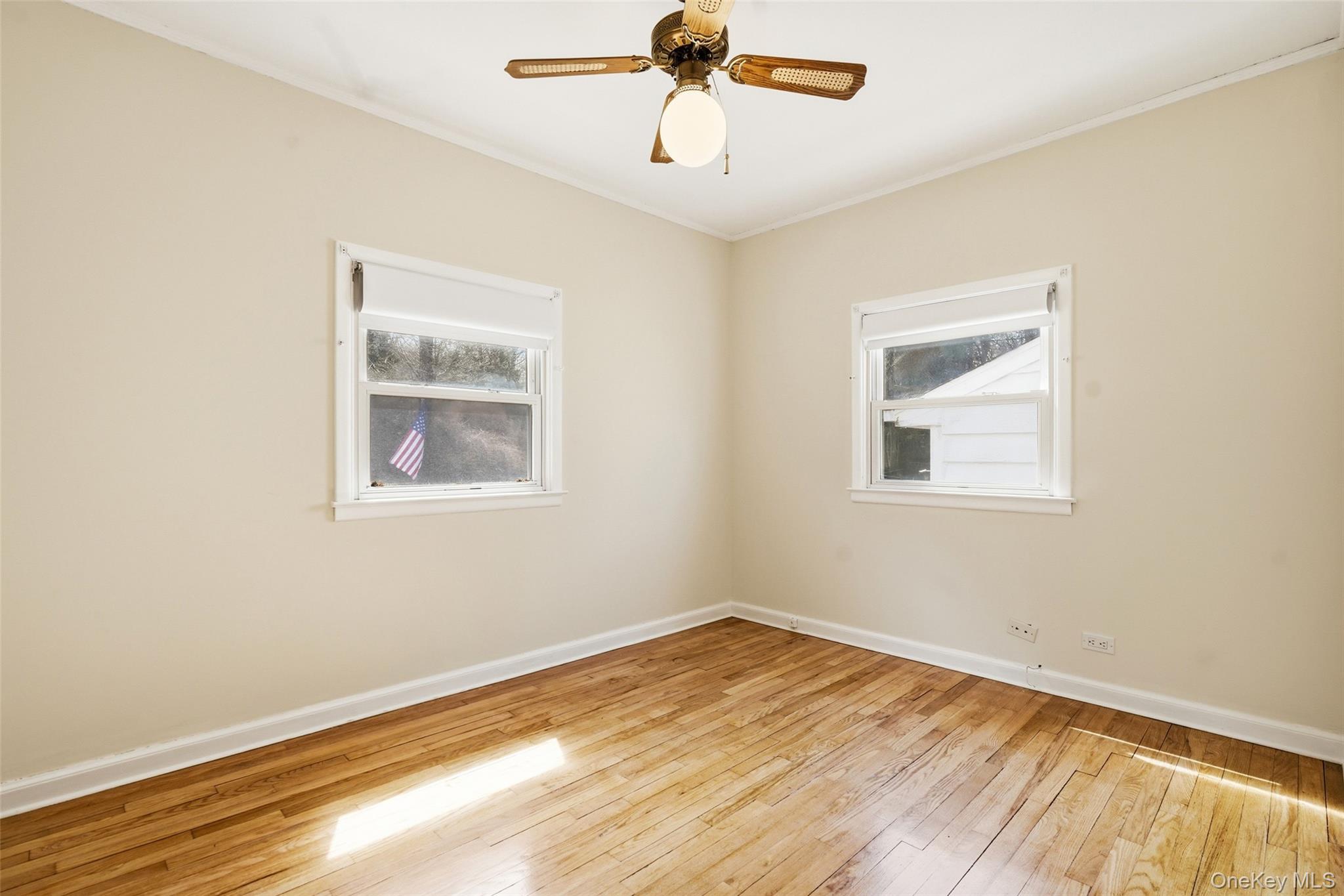 59 Brook Street Mahopac, NY 10541 - Photo 18 of 37 Bedroom #1 with hardwood floors and ceiling fan.
