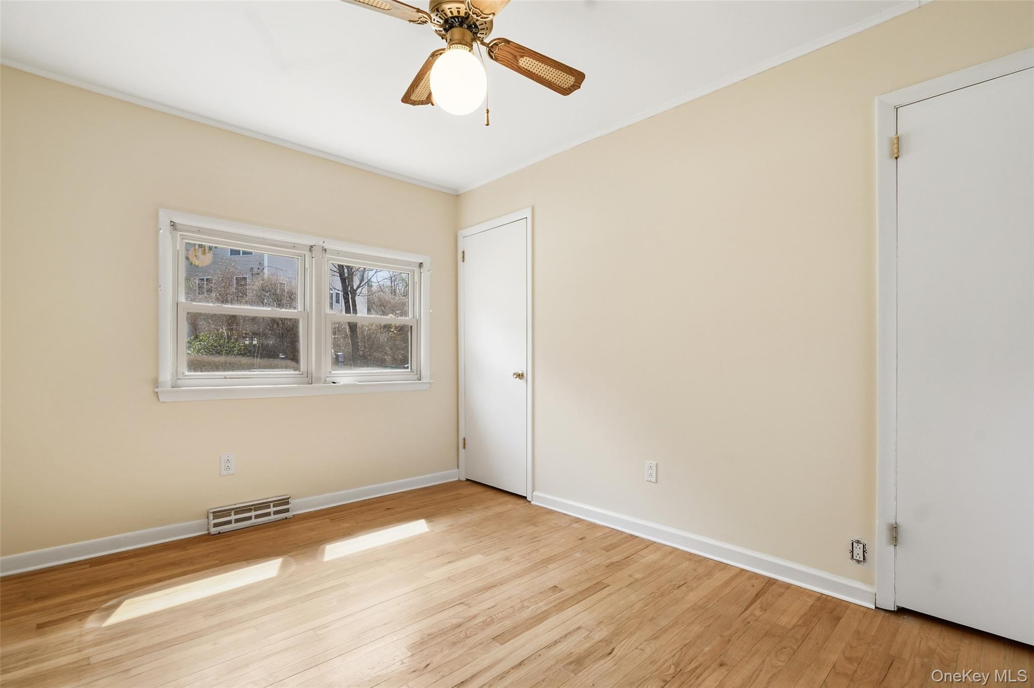 59 Brook Street Mahopac, NY 10541 - Photo 25 of 37 Bedroom #2 with hardwood floors, ceiling fan and two closets.