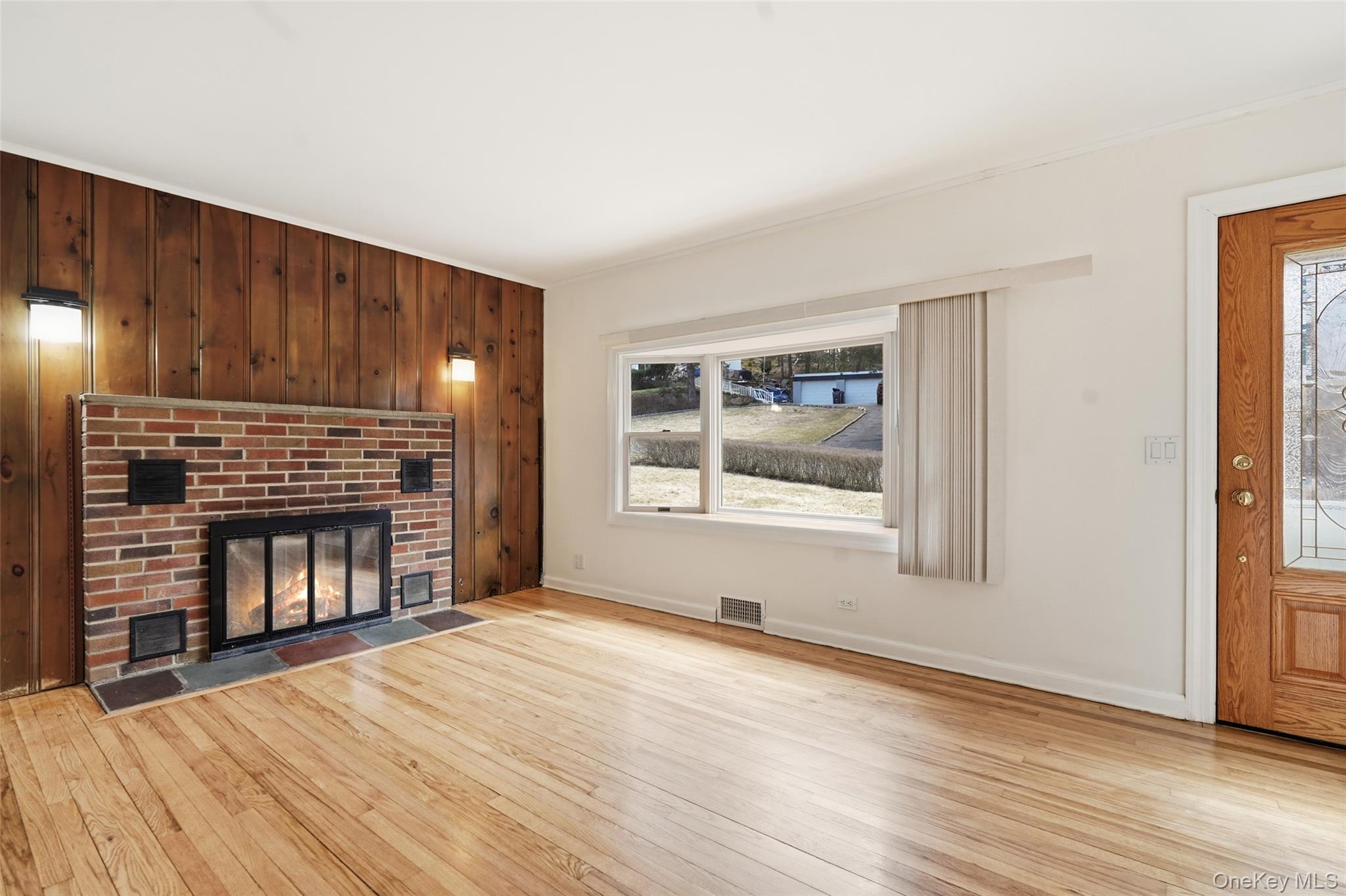 59 Brook Street Mahopac, NY 10541 - Photo 3 of 37 Living room with hardwood floors, fireplace and bay window.