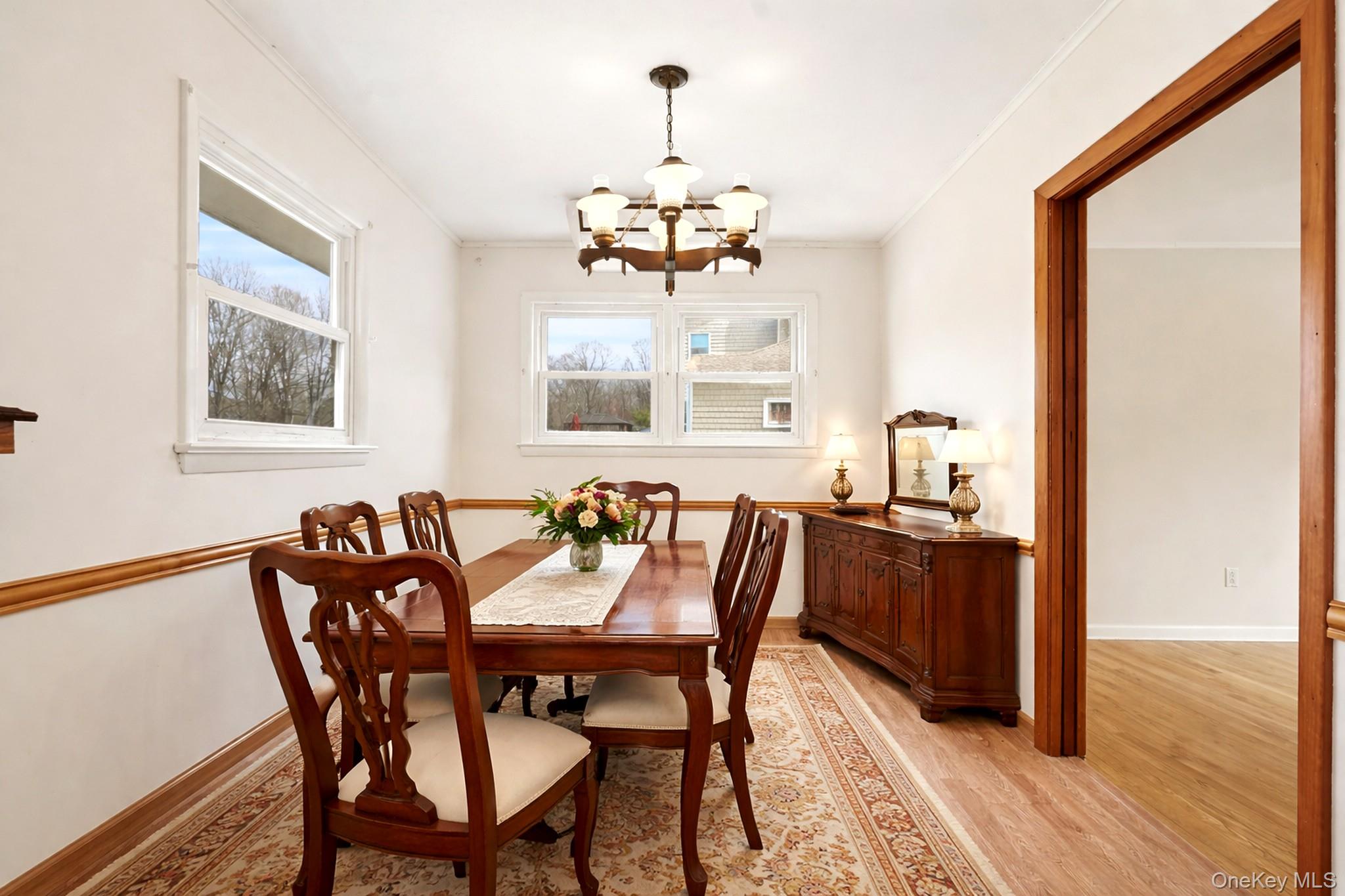 59 Brook Street Mahopac, NY 10541 - Photo 5 of 37 Dining area off of kitchen with plenty of natural light and hardwood floors. Virtually staged.