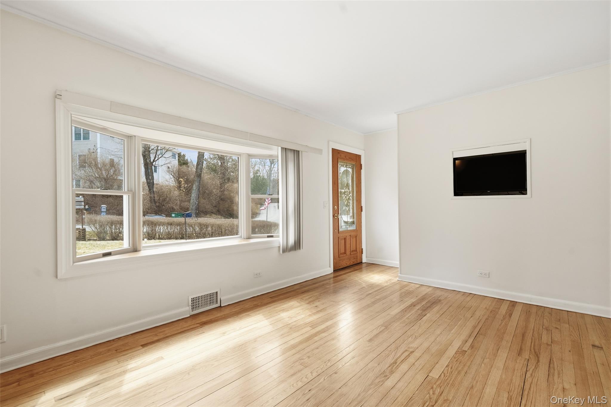 59 Brook Street Mahopac, NY 10541 - Photo 7 of 37 Bright sunfilled living room , closet at entrance.
