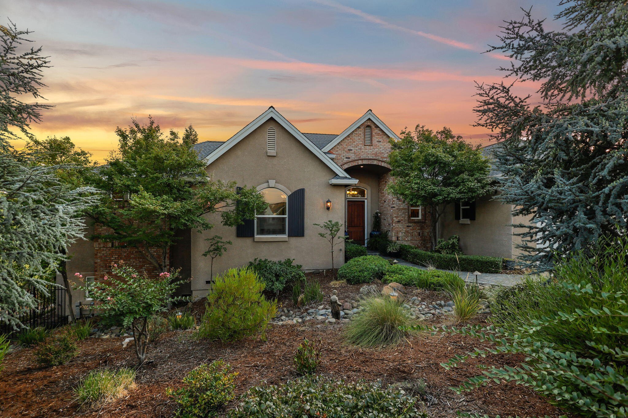 3582 Stone Ridge Place Redding, CA 96001 - Photo 1 of 34 a front view of a house with garden