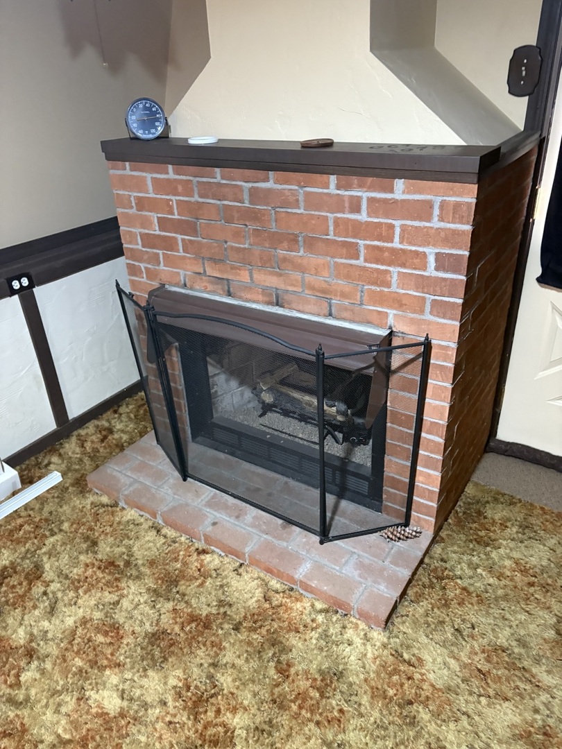 540 East 148th Place Harvey, IL 60426 - Photo 14 of 19 a view of an empty room with wooden floor and a fireplace