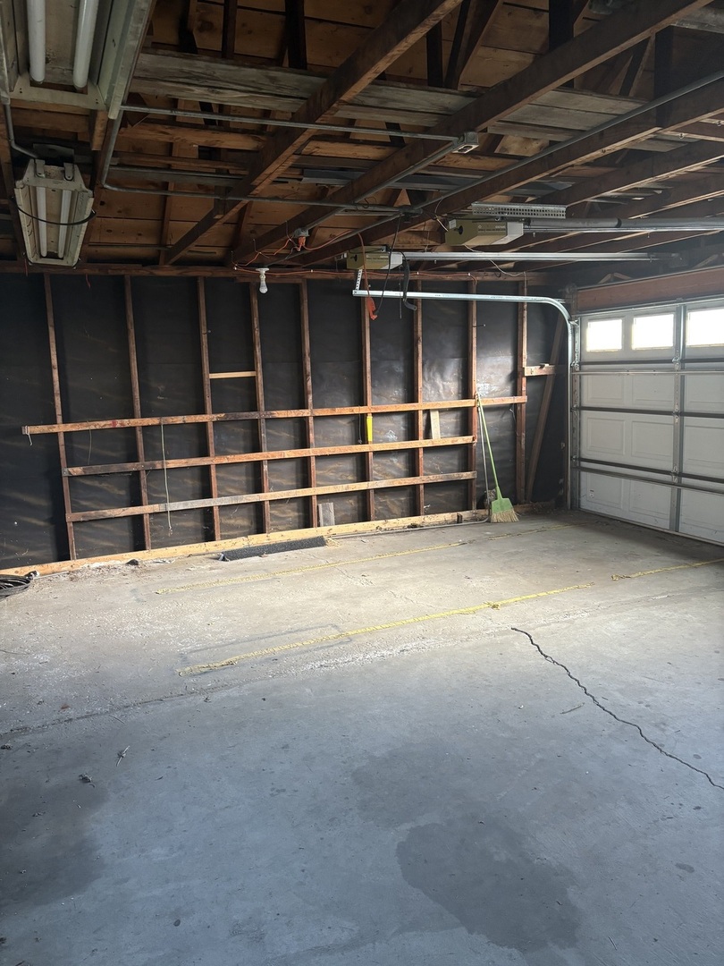 540 East 148th Place Harvey, IL 60426 - Photo 8 of 19 a view of an empty room with a garage