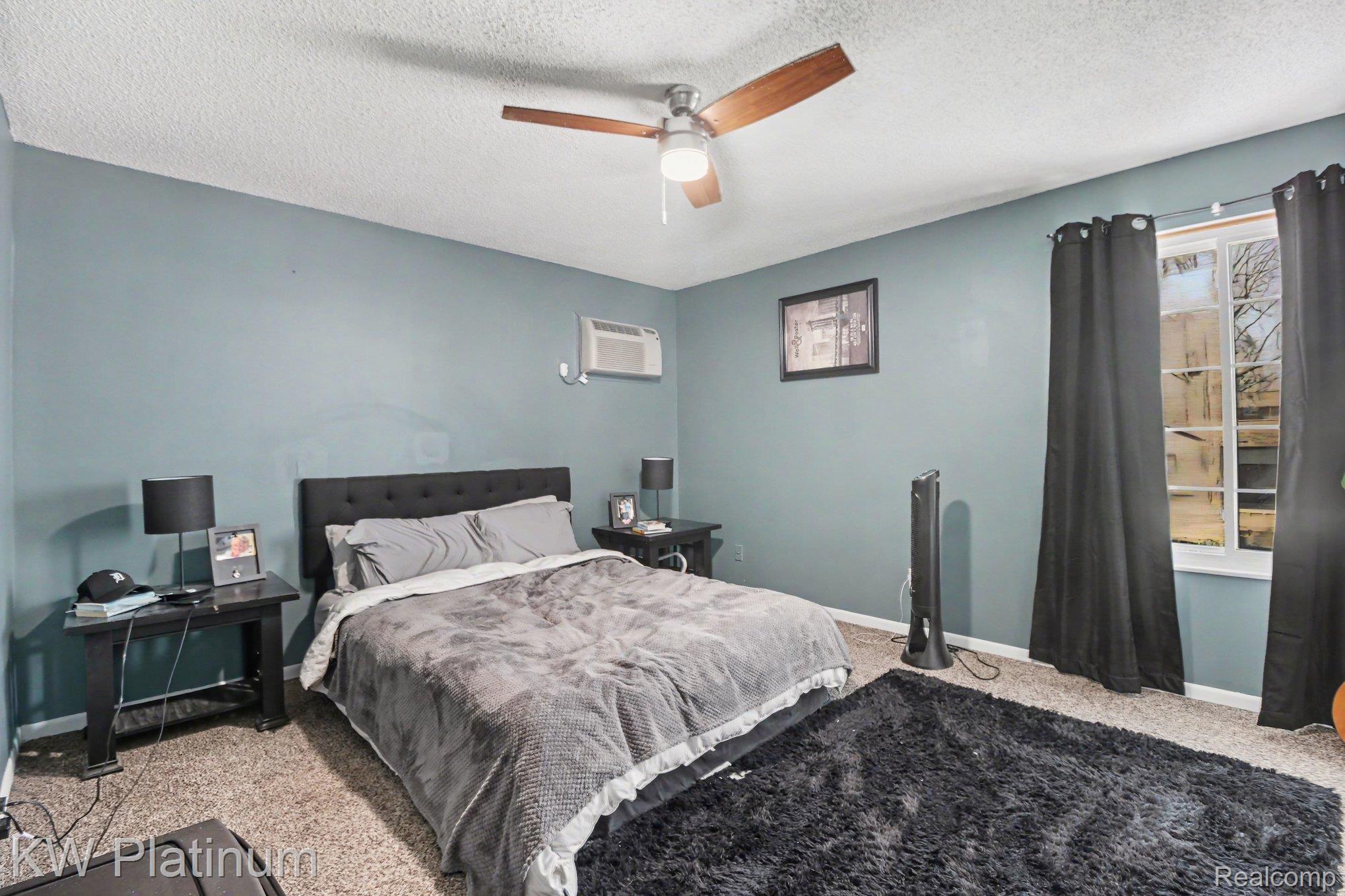 1900 River Road, Unit C5 Marysville, MI 48040 - Photo 10 of 15 Bedroom with carpet floors, a textured ceiling, and a ceiling fan