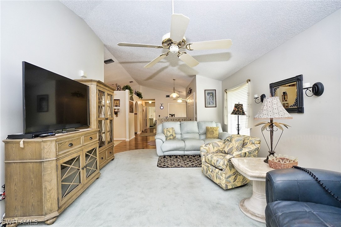 3011 Matecumbe Key Road, Unit 1 Punta Gorda, FL 33955 - Photo 4 of 14 a living room with furniture and a flat screen tv