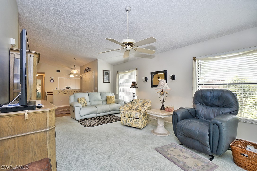 3011 Matecumbe Key Road, Unit 1 Punta Gorda, FL 33955 - Photo 5 of 14 a living room with furniture and a large window