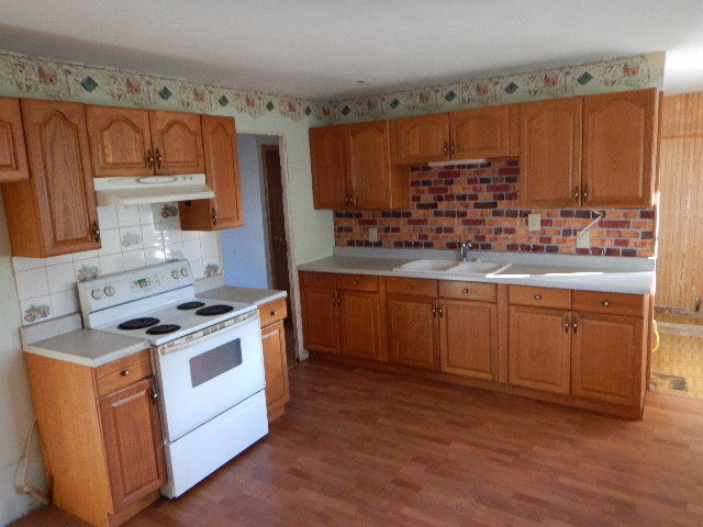 344 Hickory Avenue Romeoville, IL 60446 - Photo 3 of 11 a kitchen with stainless steel appliances granite countertop a stove a sink and a microwave