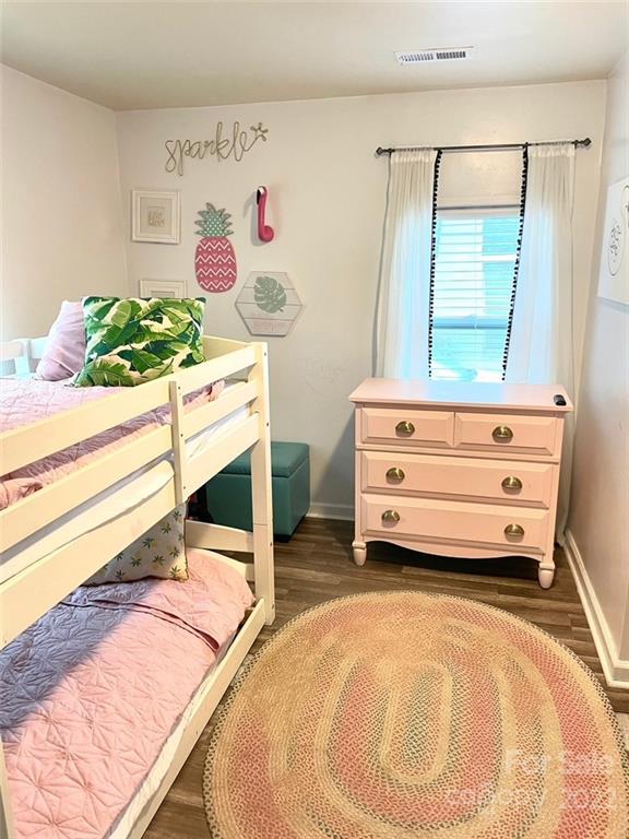 3797 Poplar Tent Road Concord, NC 28027 - Photo 14 of 15 a room with a bed and a dresser