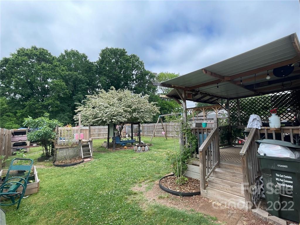 3797 Poplar Tent Road Concord, NC 28027 - Photo 5 of 15 a view of a chairs and table in backyard