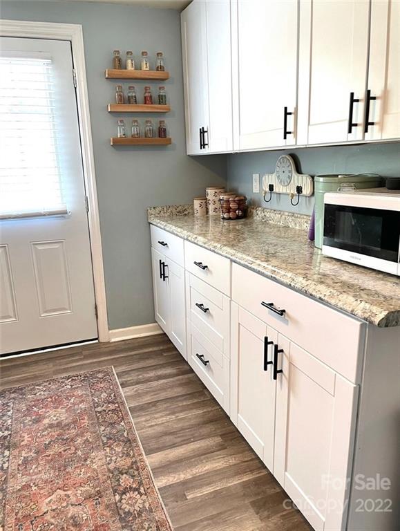 3797 Poplar Tent Road Concord, NC 28027 - Photo 10 of 15 a kitchen with granite countertop a sink and a stove top oven