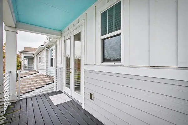 a view of front door deck and living room