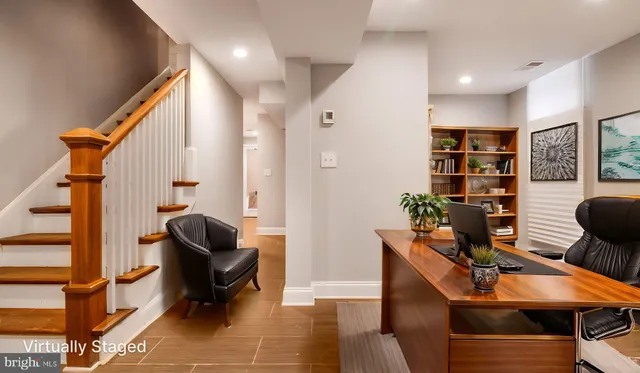 a room with furniture and gym equipment
