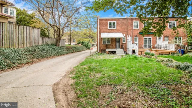 a view of a house with a back yard