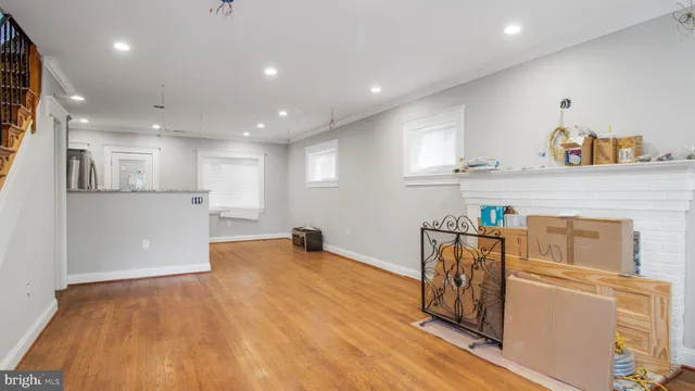a view of kitchen with furniture and wooden floor