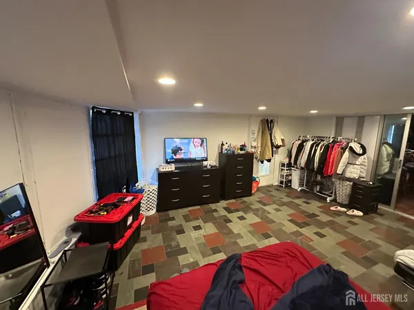 a bedroom with a bed and a closet