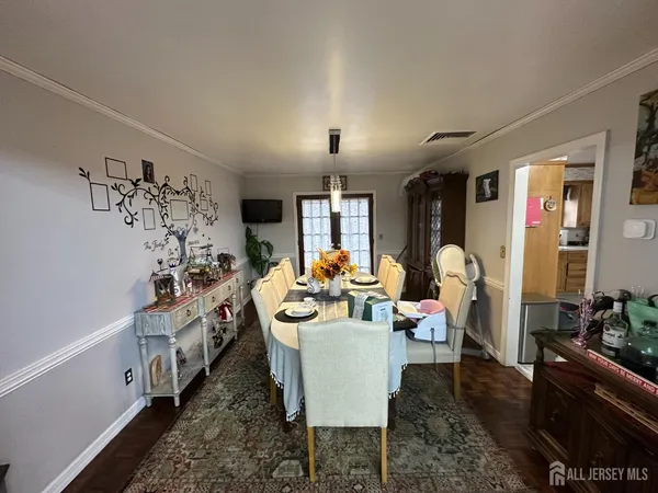 a very nice looking dining room with kitchen island furniture and a wooden floor