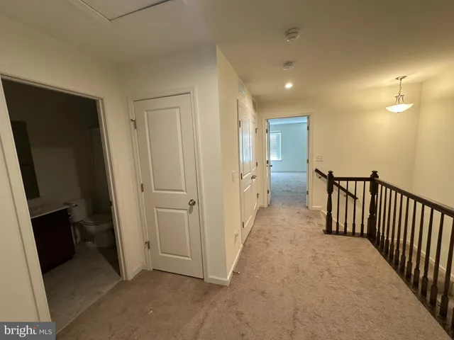 a bathroom with a toilet a sink and a mirror