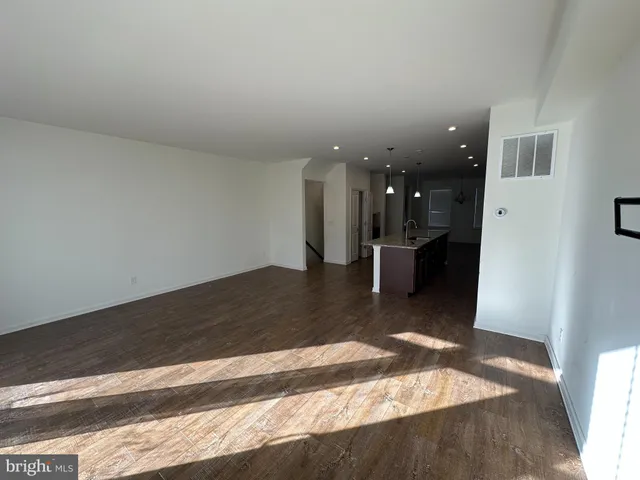 a view of a living room and kitchen