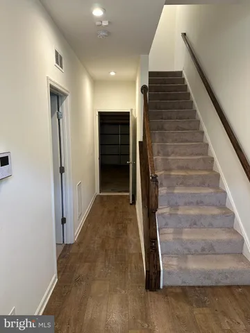 a view of entryway with wooden floor