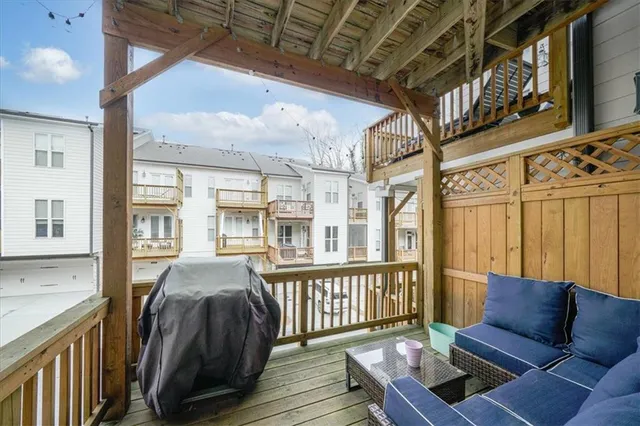 a view of a balcony with furniture