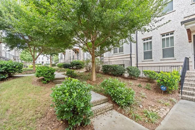 an aerial view of house with yard swimming pool and outdoor seating