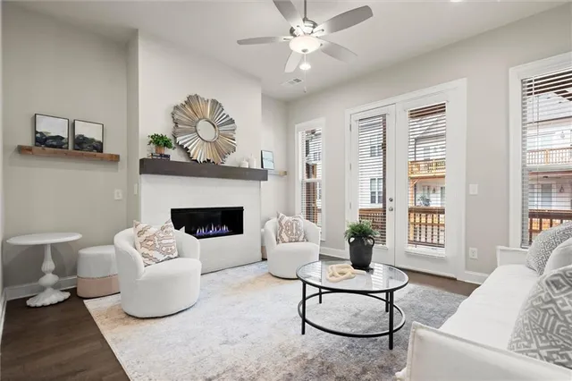 a living room with furniture and a fireplace