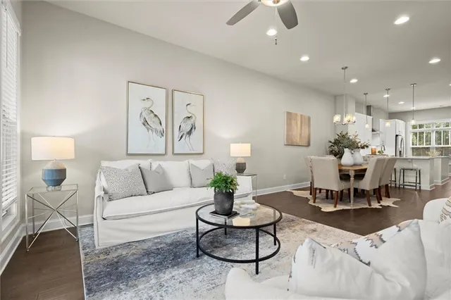 a living room with furniture and white walls