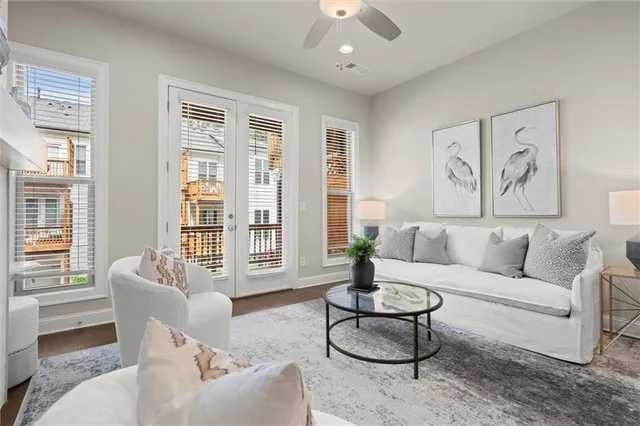 a living room with furniture and a large window