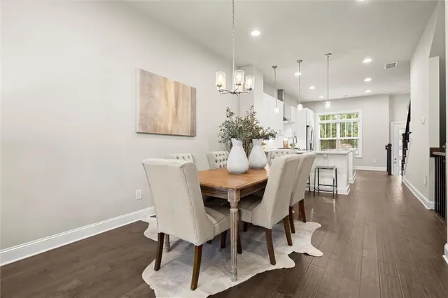 a view of a dining room with furniture and wooden floor