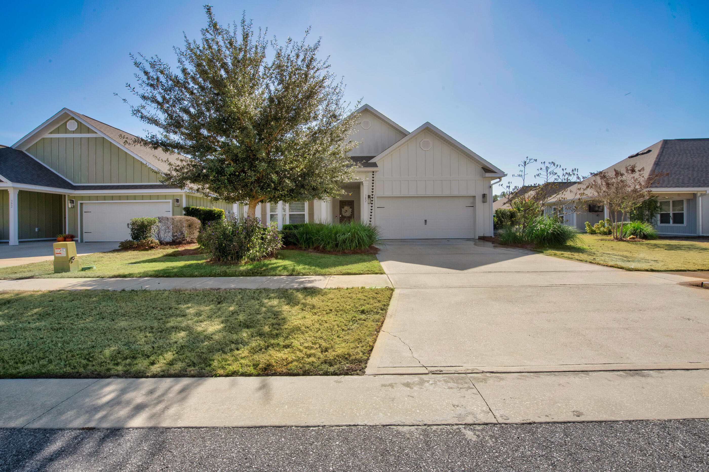 382 Lightning Bug Lane Freeport, FL 32439 - Photo 1 of 33 a front view of a house with garden