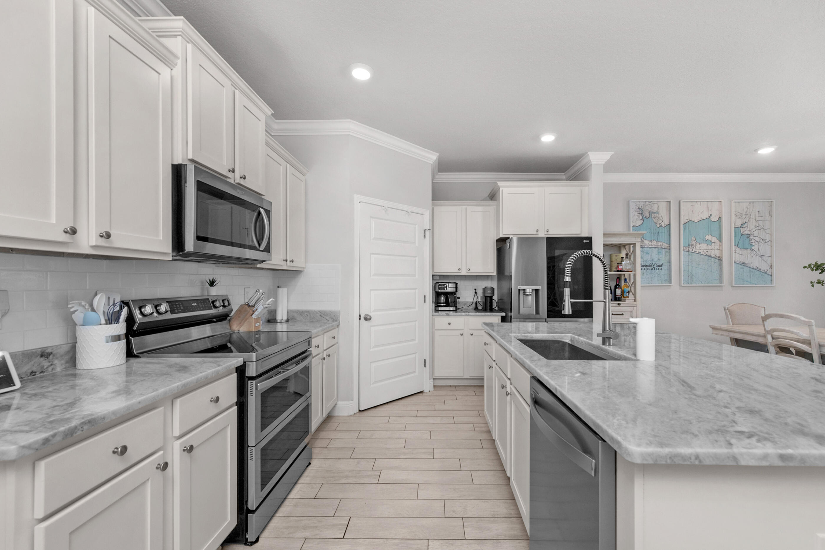 382 Lightning Bug Lane Freeport, FL 32439 - Photo 14 of 33 a kitchen with stainless steel appliances granite countertop a sink stove and refrigerator