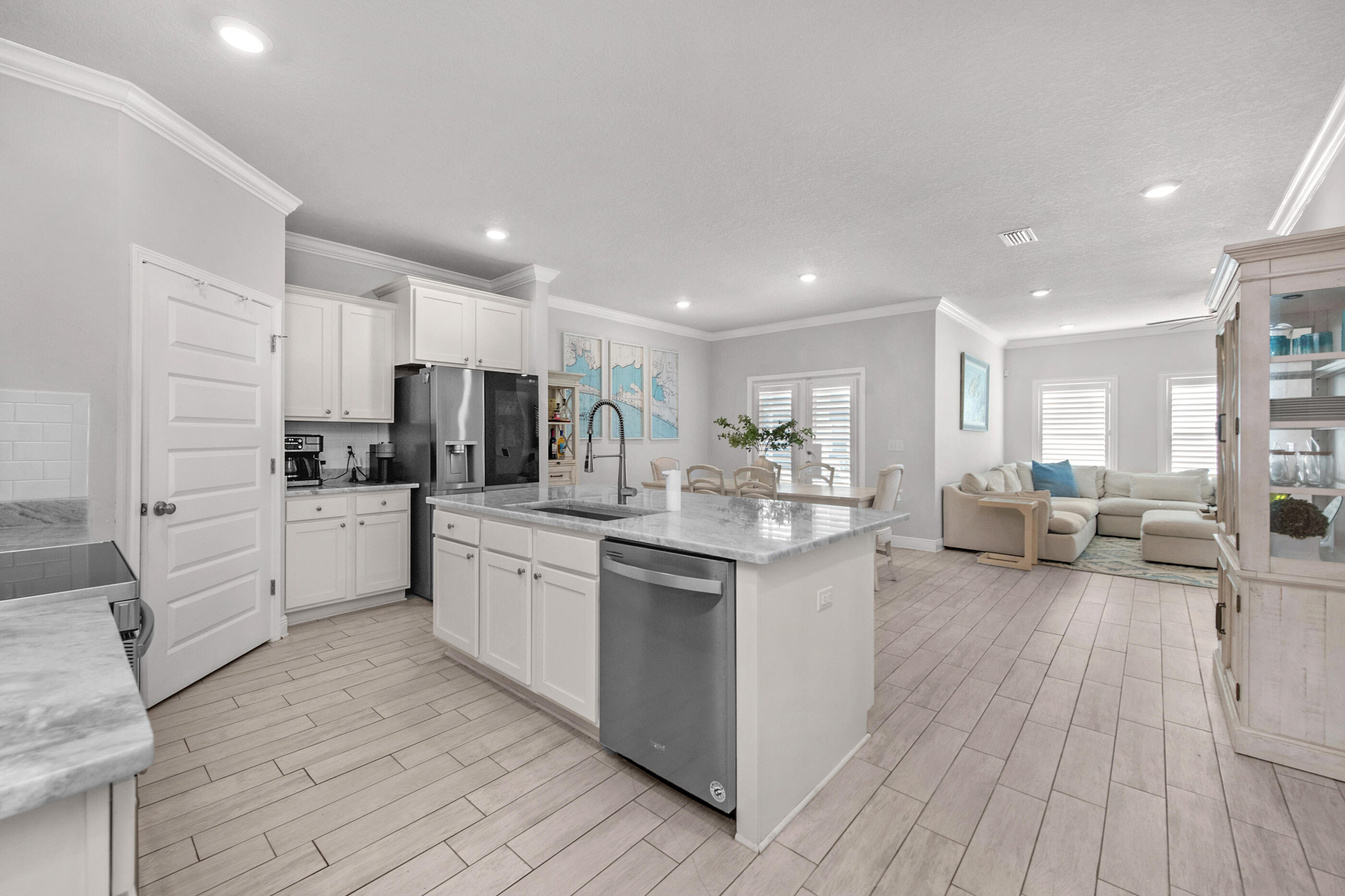 382 Lightning Bug Lane Freeport, FL 32439 - Photo 15 of 33 a kitchen with white cabinets and sink