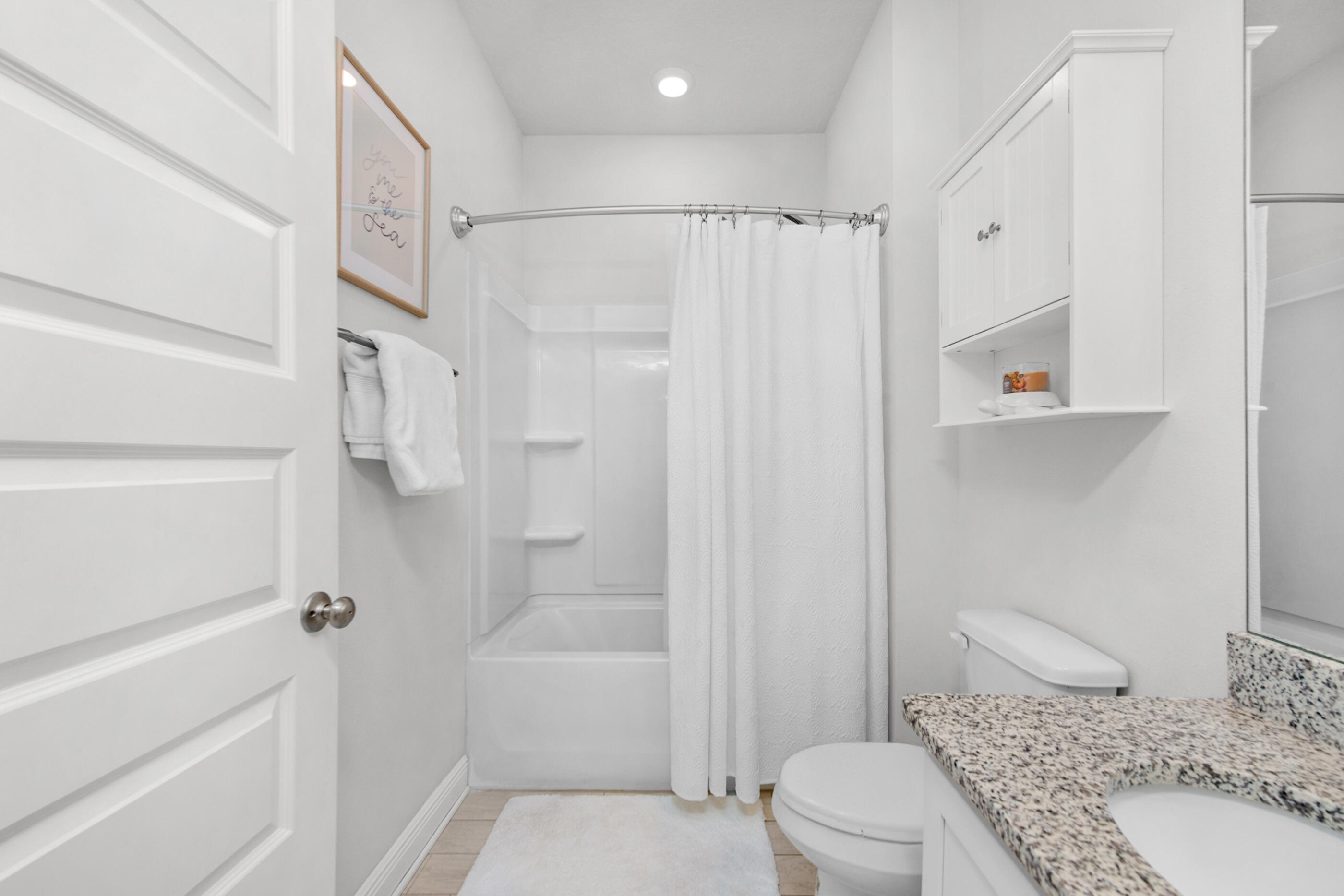 382 Lightning Bug Lane Freeport, FL 32439 - Photo 24 of 33 a bathroom with a granite countertop sink toilet and shower