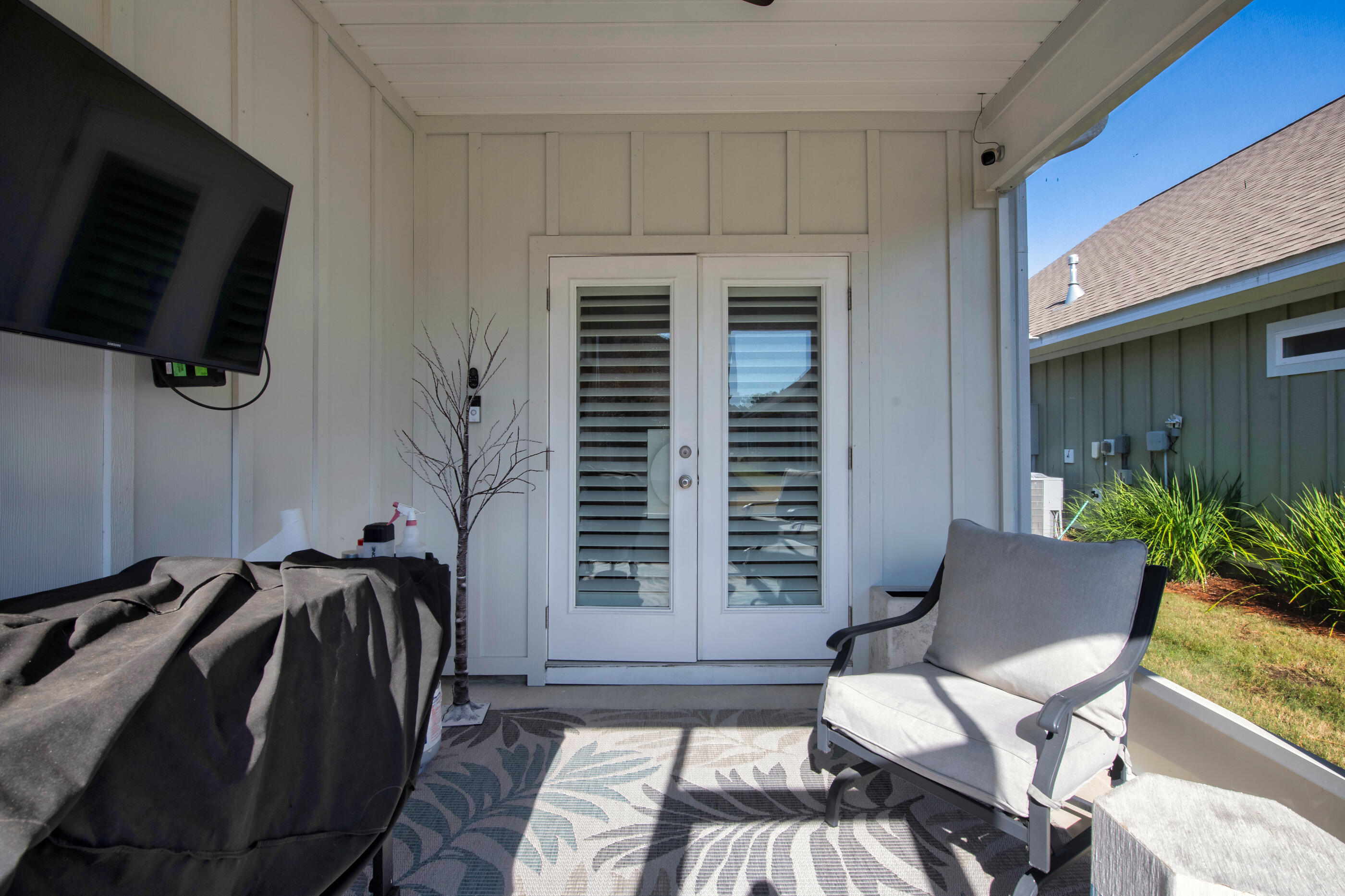 382 Lightning Bug Lane Freeport, FL 32439 - Photo 32 of 33 a view of a livingroom with furniture and a flat screen tv