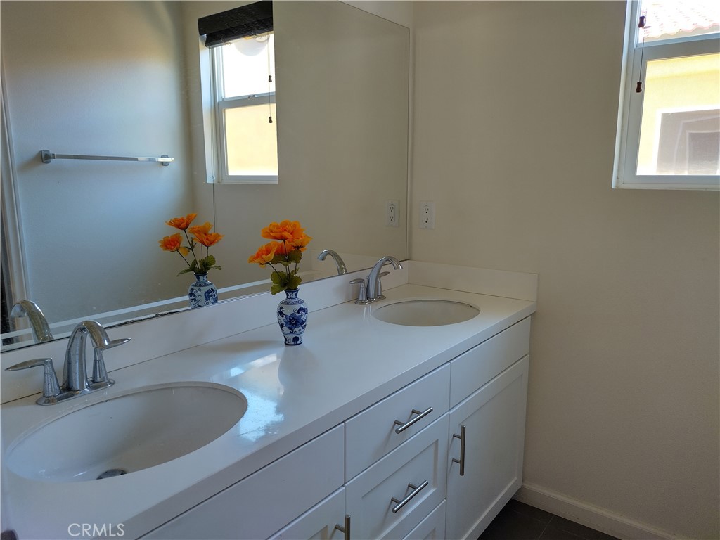 11811 Cramer Road Yucaipa, CA 92399 - Photo 42 of 56 a bathroom with a sink and a mirror