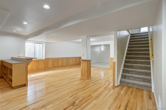 a view of a living room with wooden floor