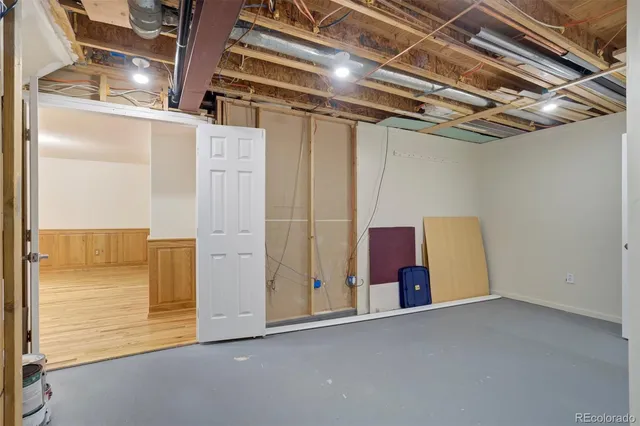 a view of a room with wooden walls