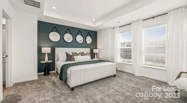 a bed room with a bed and a window