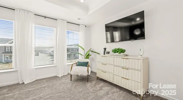 a bedroom with furniture and a window