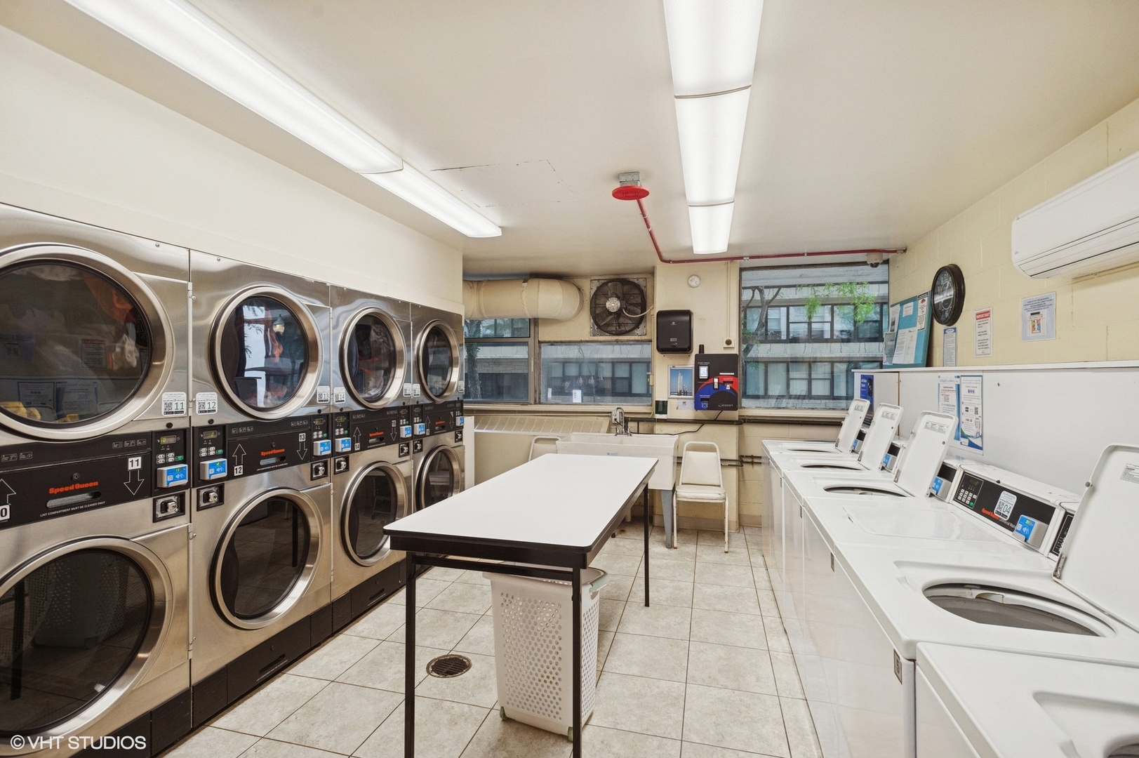 5757 North Sheridan Road, Unit 20J Chicago, IL 60660 - Photo 19 of 20 a kitchen with a stove a microwave and cabinets