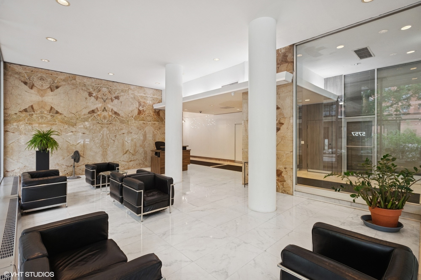 5757 North Sheridan Road, Unit 20J Chicago, IL 60660 - Photo 20 of 20 a living room with furniture potted plant and kitchen view