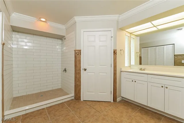 a bathroom with a shower and a sink
