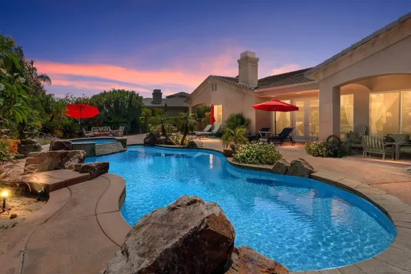 a view of a swimming pool with sitting area